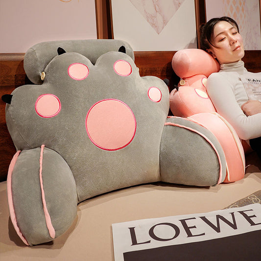 Gray cat-paw reading pillow with rounded paws and pink outlined face details