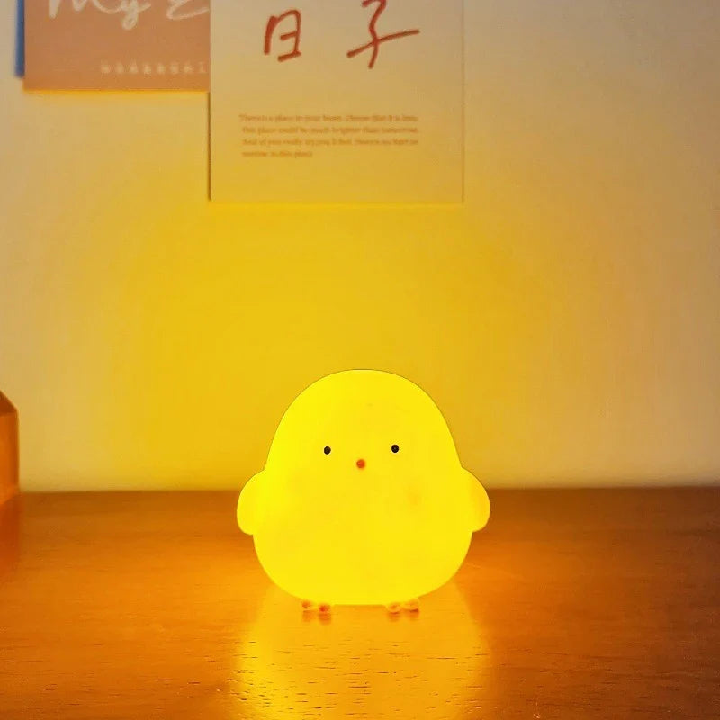 Yellow silicone chick LED night light with face details