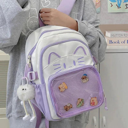 Purple and white cat-face school backpack with mesh front pocket and plush keychain