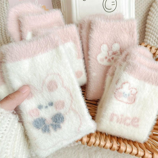 Bunny socks set in white with pastel paw prints and bunny motifs, fuzzy soft fabric.