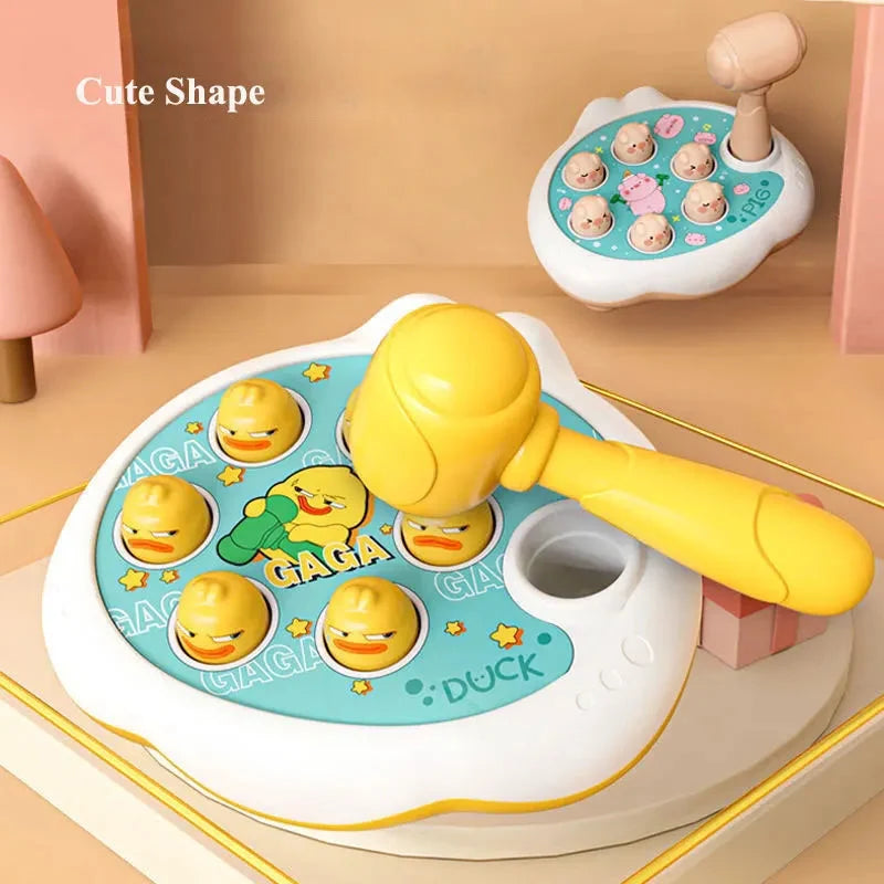 Duck shape hammer toy with yellow mallet and round base filled with smiling duck faces