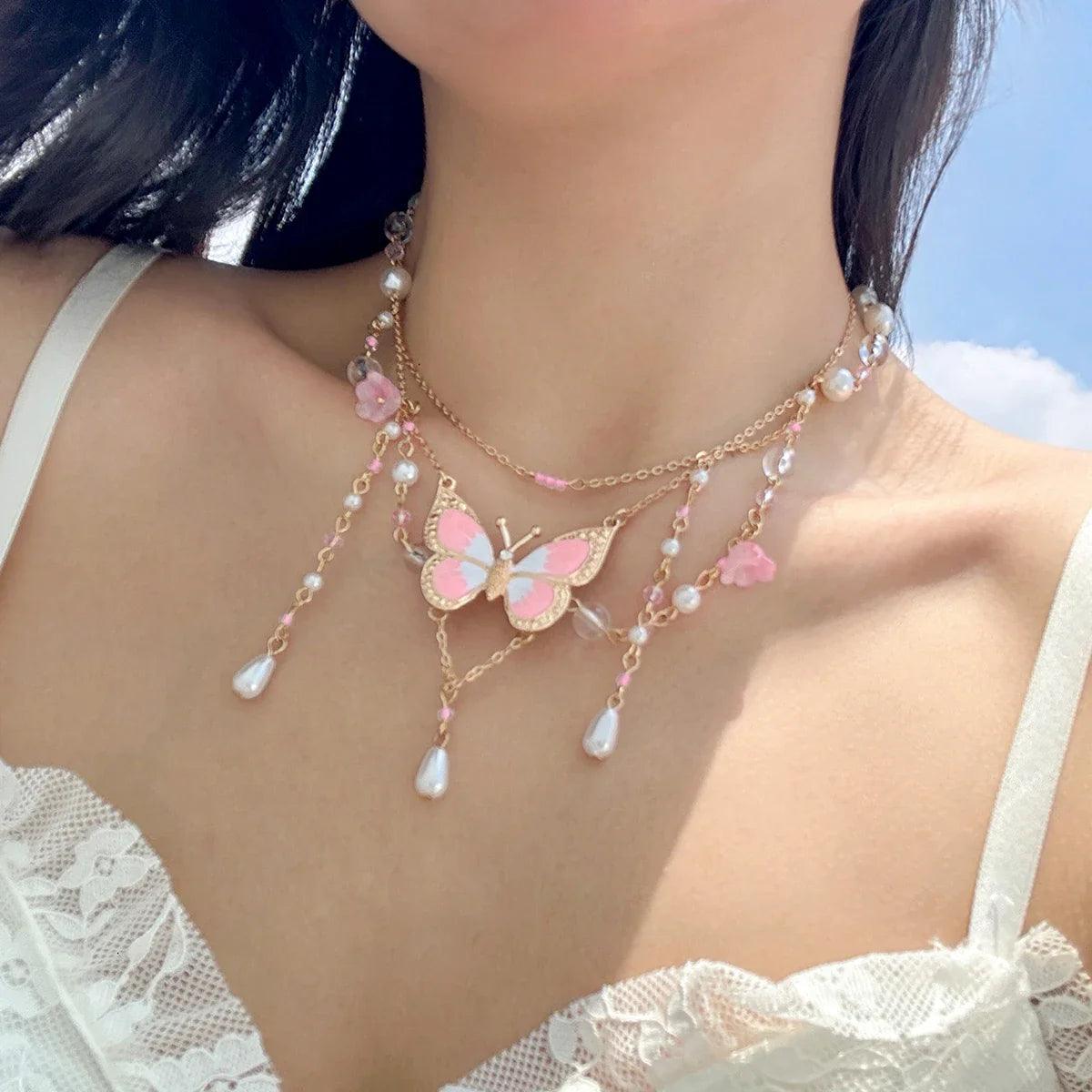 Butterfly imitation pearl multi-layer necklace with pink beads and white pearl drop tassels