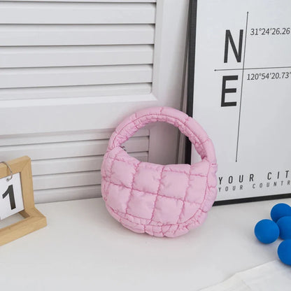 Quilted puffer circle mini bag with top handle, rose pink padded nylon.