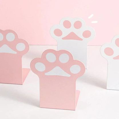 Three cat paw bookends with pink bases and white paw emblems, desk organizer