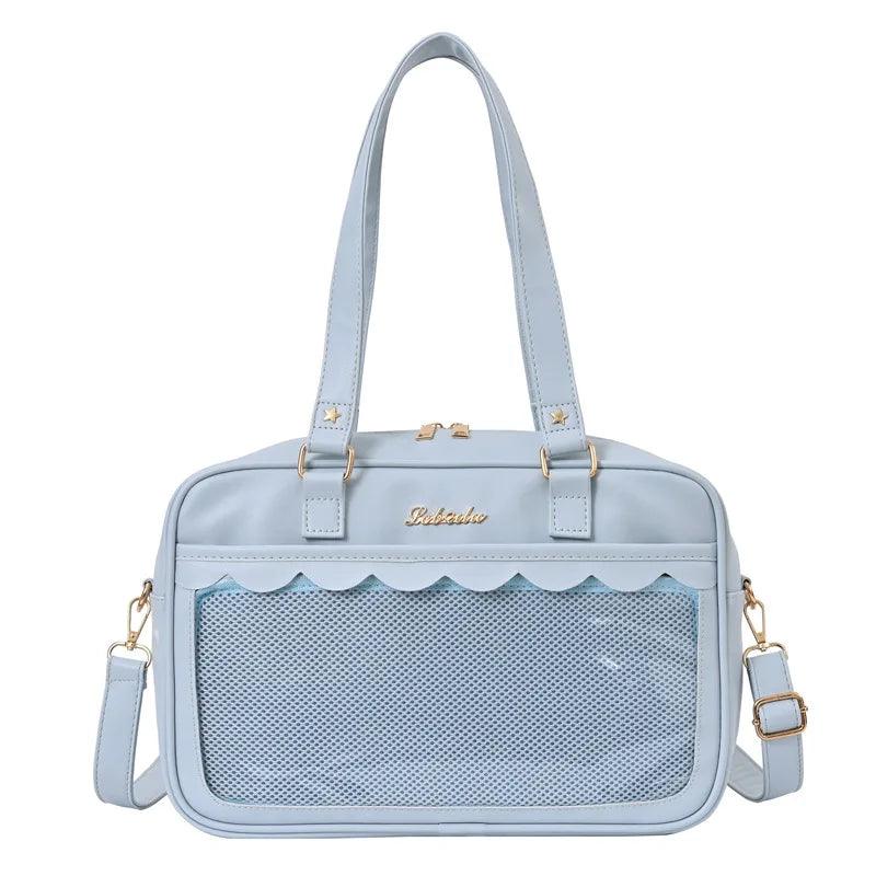 Light blue messenger bag with scalloped top edge and mesh front pocket panel