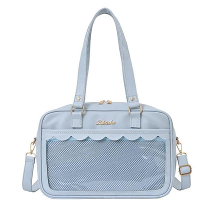 Light blue messenger bag with scalloped top edge and mesh front pocket panel