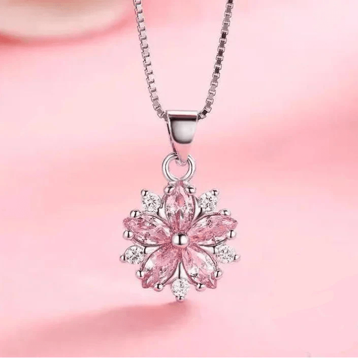 Pink cherry blossom pendant on silver-tone chain with teardrop clasp