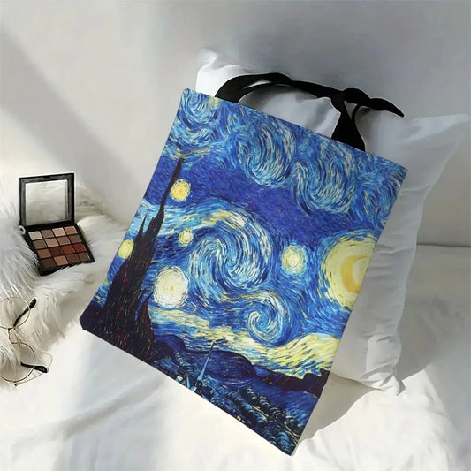 Canvas tote bag with Starry Night print, black handles and ribbon bow
