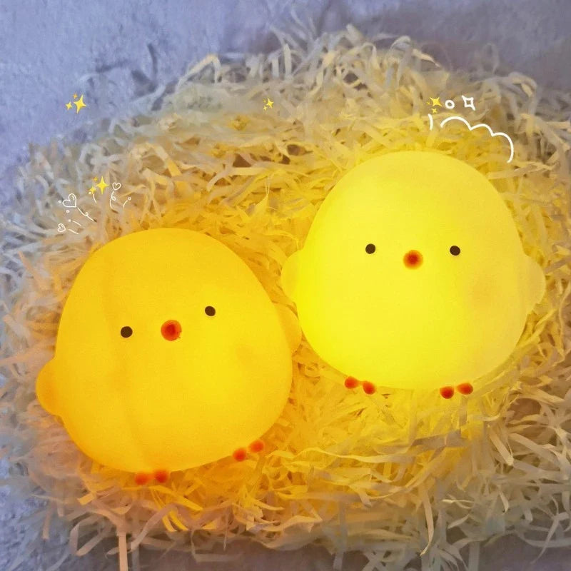 Pair of yellow silicone chick LED night lights with cute faces