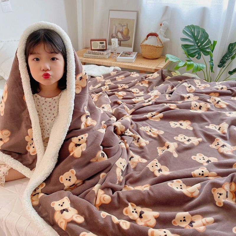 Gray lamb fleece blanket with teddy bear faces pattern and plush sherpa lining.