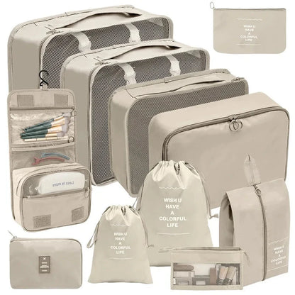 Beige travel packing organizers with gray mesh cubes and assorted zip pouches