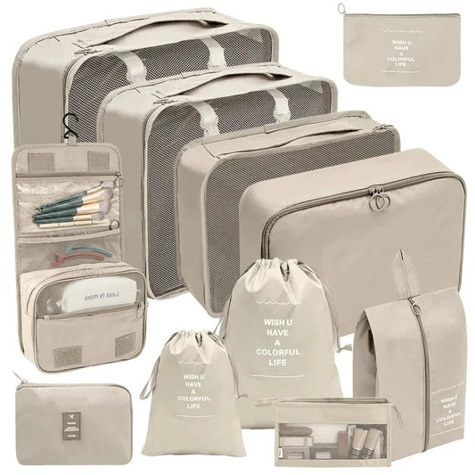 Beige travel packing organizers with gray mesh cubes and assorted zip pouches