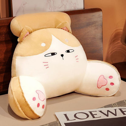 Cream and tan plush reading pillow with fox-like face and paw detail patches