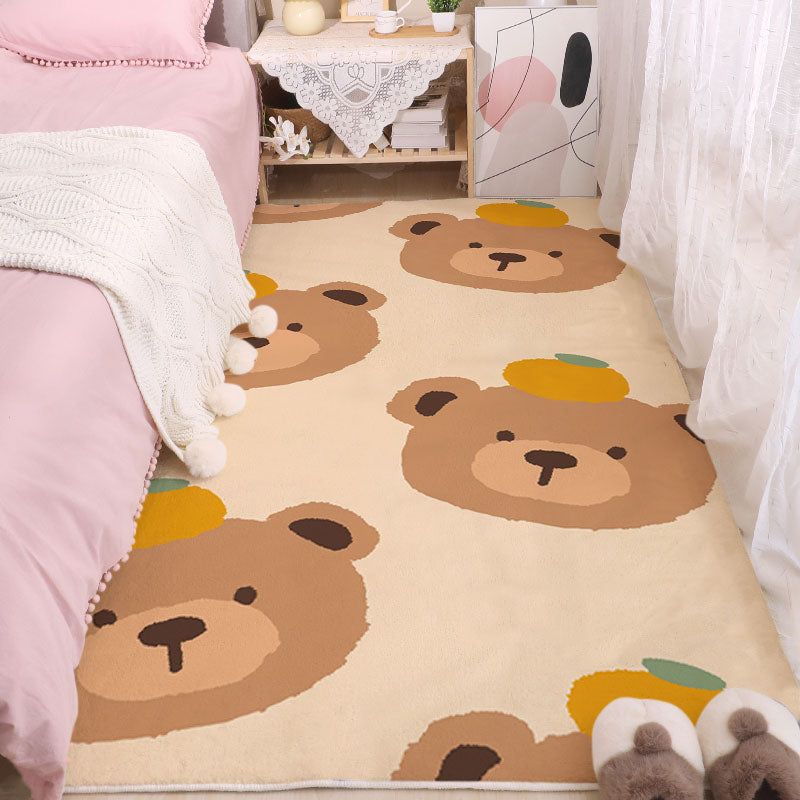 Kids animal face print area rug with tan bear shapes on cream background.