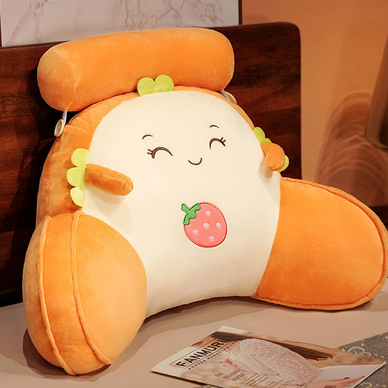 Orange and white plush reading pillow with happy strawberry-themed face and soft ears