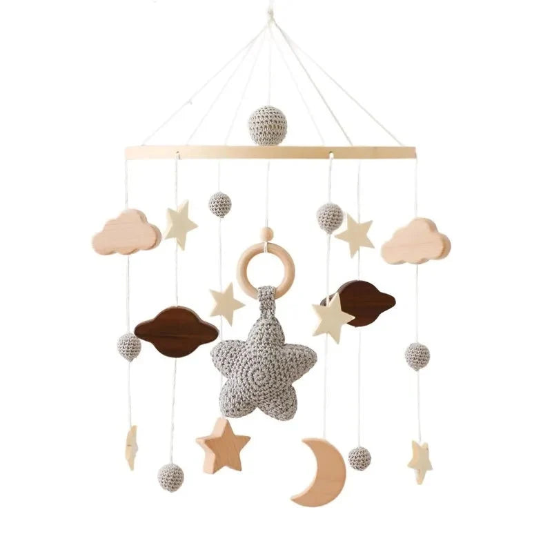 Wooden baby crib mobile with grey star and cloud charms, moon, and hanging bead strands