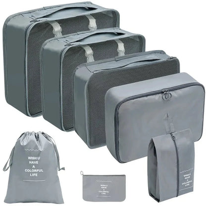 Blue-gray packing cube set with gray mesh panels and zip pouches for travel