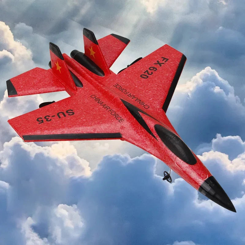 Red RC foam fighter glider with black propellers and FX620 markings