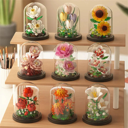 Mini flower bouquet building set under clear dome with dark base, multi-color blooms.