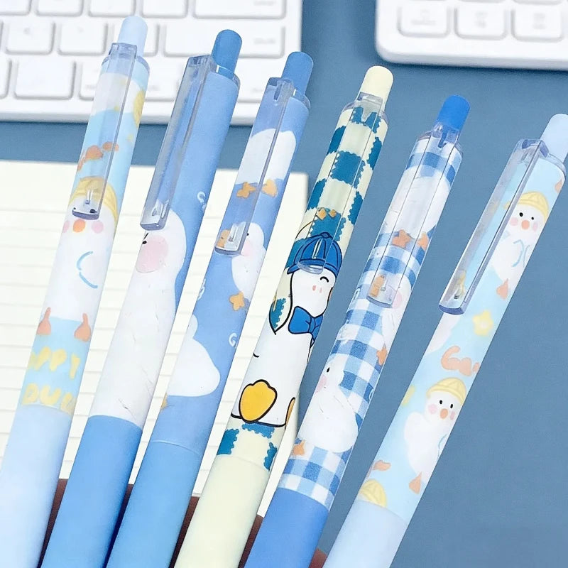 Duck gel pens with blue caps and clear barrels, cartoon ducks and plaid patterns