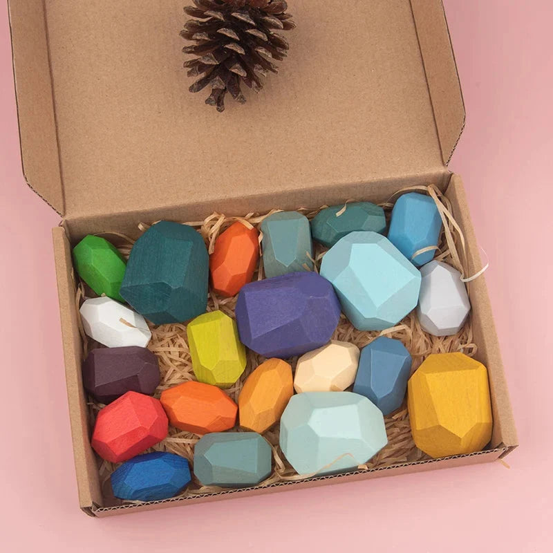 Box of wooden sorting stacking rocks with multicolor faceted pieces