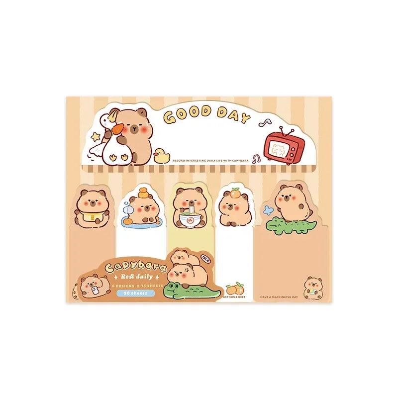Capybara daily sticky note sheet with cartoon animal faces and a striped top banner