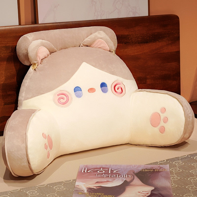 Grey cat reading pillow with cream face panel, swirl eyes and paw print accents