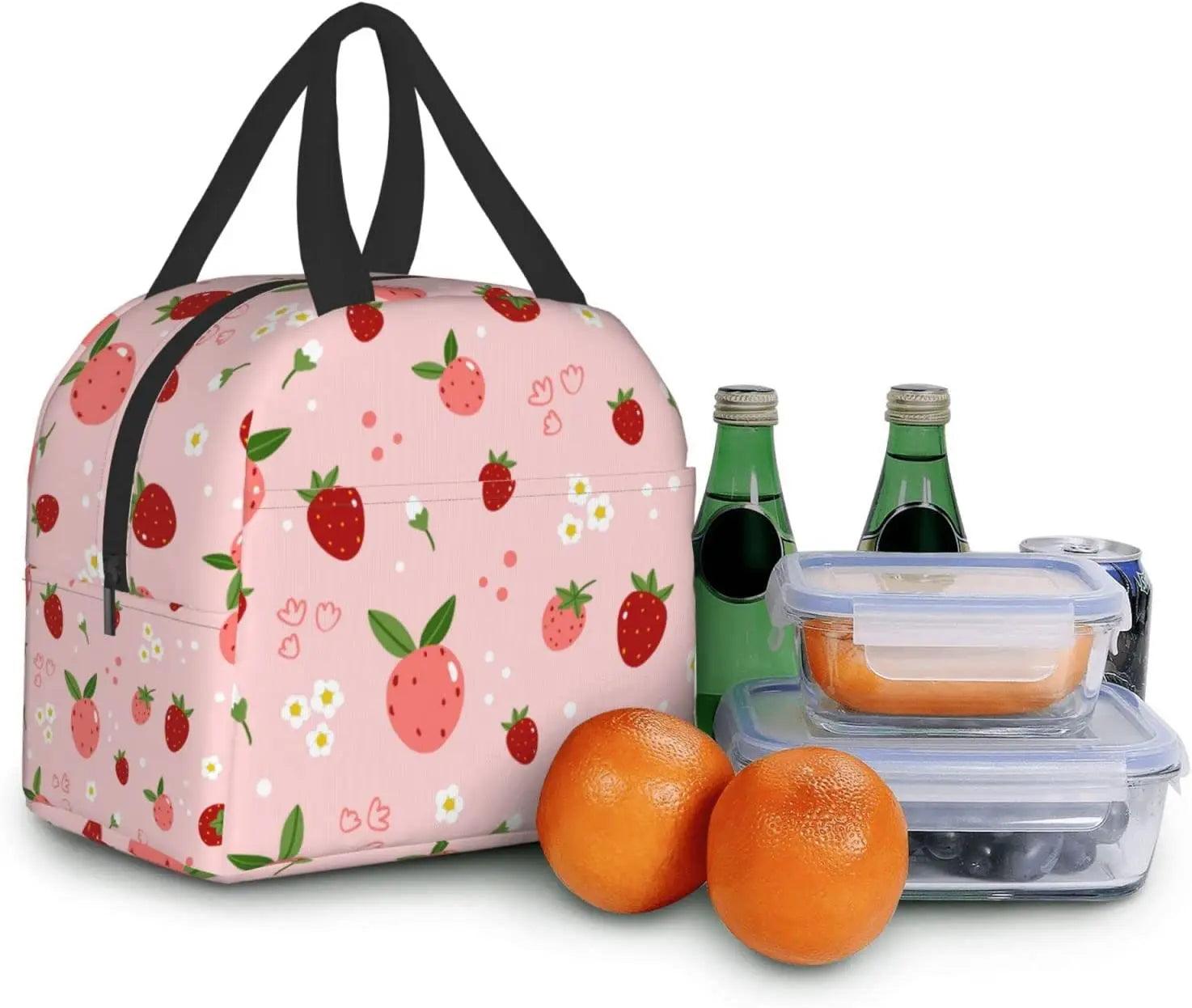 Pink insulated lunch bag with strawberry print, black handles, with bottles and containers