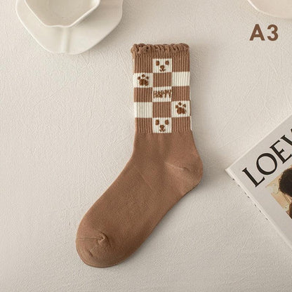 Teddy bear socks with brown legs and white checkered cuff, bear square appliques