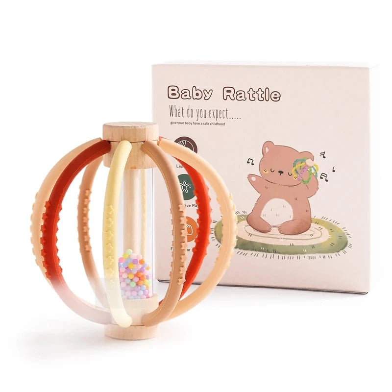 Baby rattle teether toy with red and beige silicone rings and wood handle