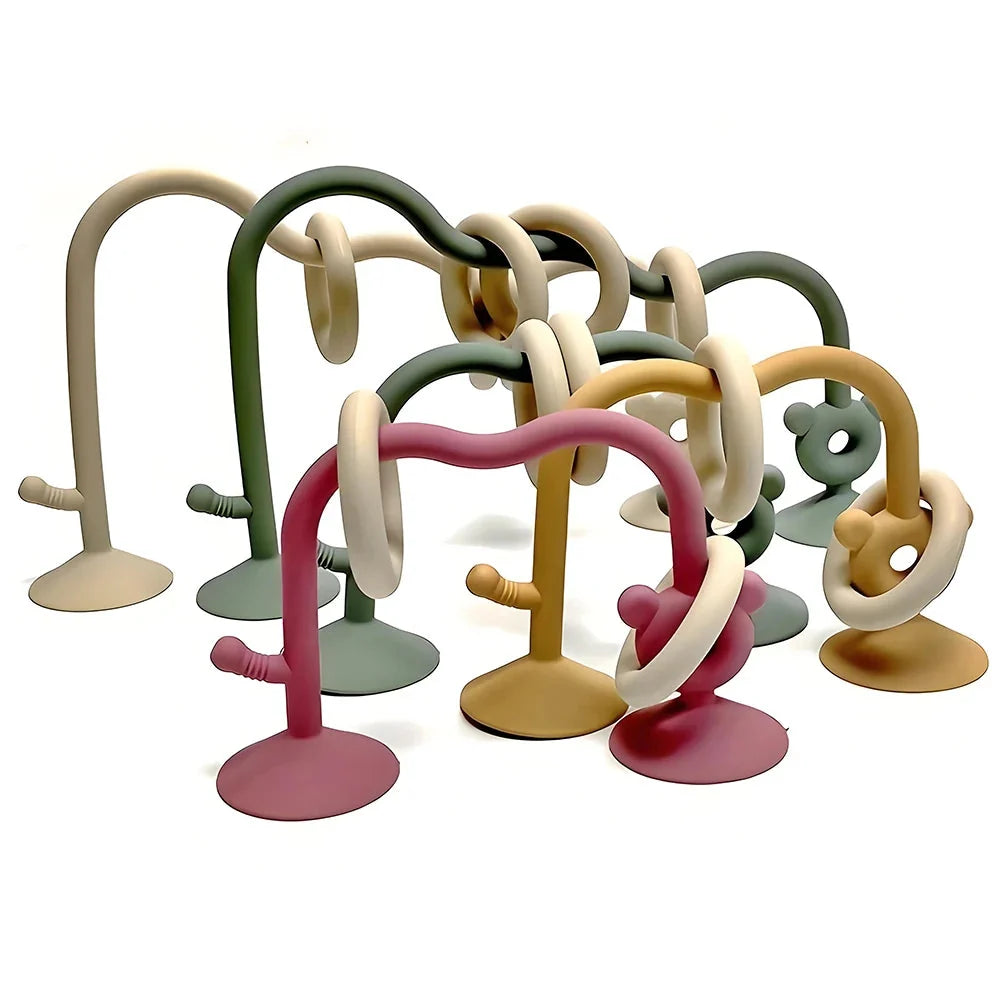 Silicone bead wrap baby learning toy with green, cream, and gold loops, suction cups, animal pegs