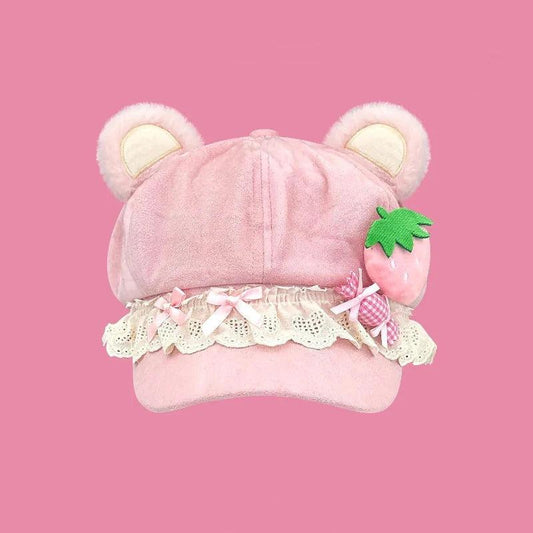 Pink bear cap with lace ruffle, check bow strap, green strawberry applique