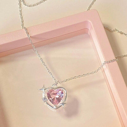 Heart crystal pendant necklace with silver-tone chain and pink faceted heart charm