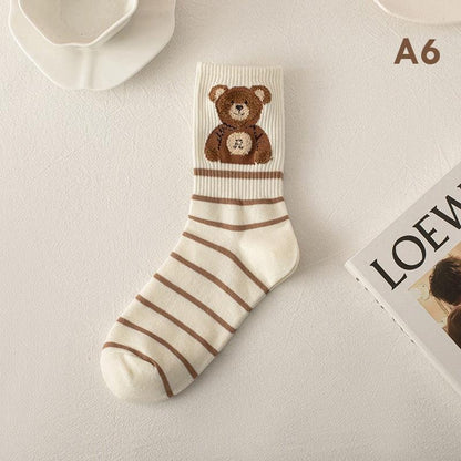 Cream socks with brown teddy bear graphic and horizontal striped pattern