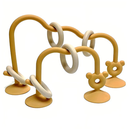 Silicone bead wrap baby learning toy with yellow loops, cream beads, and bear-shaped suction posts