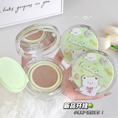Air cushion foundation compacts in clear cases with green cushion inserts and bear flower graphics