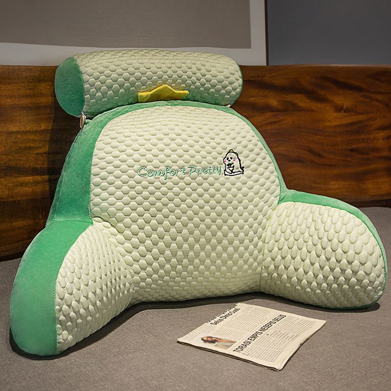 Green and cream plush reading pillow with padded front and character patch