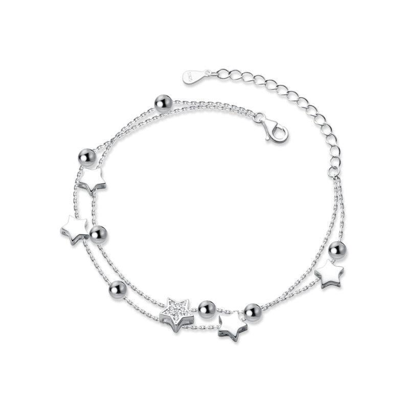 925 sterling silver star bracelet with star charms, round bead accents, and clasp extension.