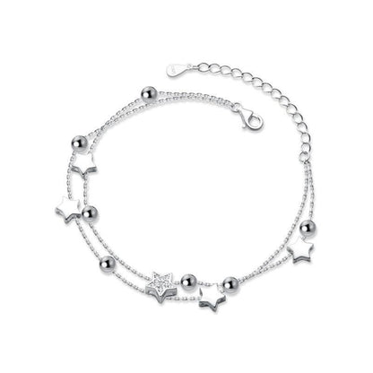 925 sterling silver star bracelet with star charms, round bead accents, and clasp extension.