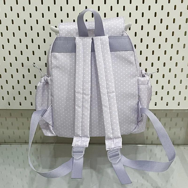 Light purple polka dot backpack with padded back panel, straps, and top carry handle