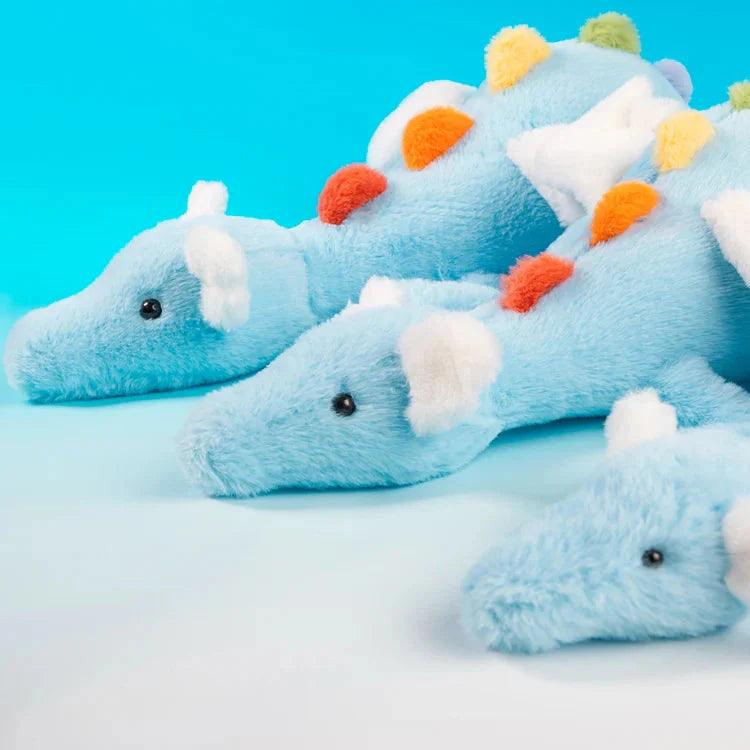 Rainbow dragon plush toy trio, light blue plush with white paws and multicolor pom head