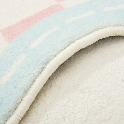 Cream bound edge of pastel plush area rug with light blue stripe.