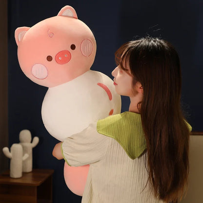 Pig dango snack plush with pastel pink face, rounded body and small ears, held