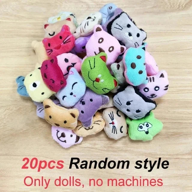 Pile of small assorted animal plush dolls with different colors and faces