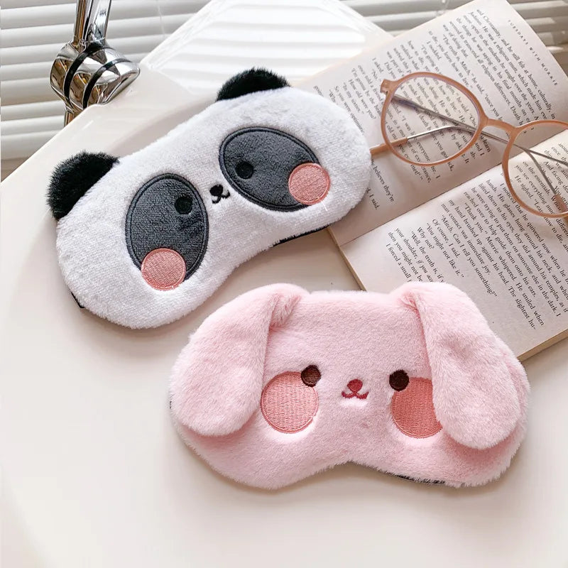 Bunny plush sleep mask with white fabric and pink nose, stitched eyes, and long ears