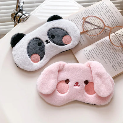 Bunny plush sleep mask with white fabric and pink nose, stitched eyes, and long ears