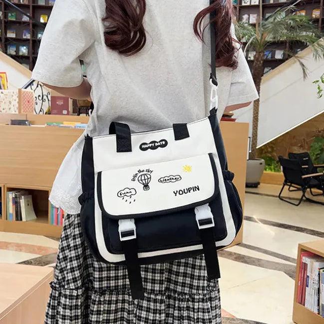 Black 3-piece backpack set with white front pocket panel and buckled strap details