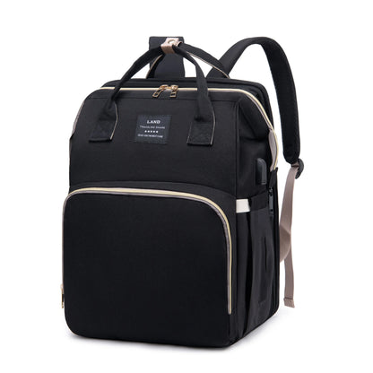 Black travel backpack diaper bag with front pockets and double top handles