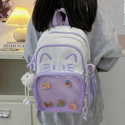 Purple and white cat-face school backpack shown from the back on a person
