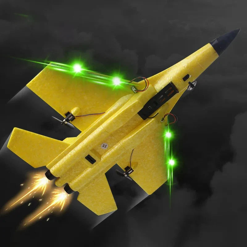 Yellow RC foam RC fighter glider with glowing green lights